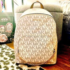 Micheal Kors white and brown leather backpack with gold accent chain